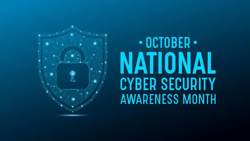 Graphic for October National Cybersecurity Awareness Month featuring a shield with a digital lock icon made of connected blue dots. Bold text reads 'National Cyber Security Awareness Month' on a dark blue background, symbolizing online protection.