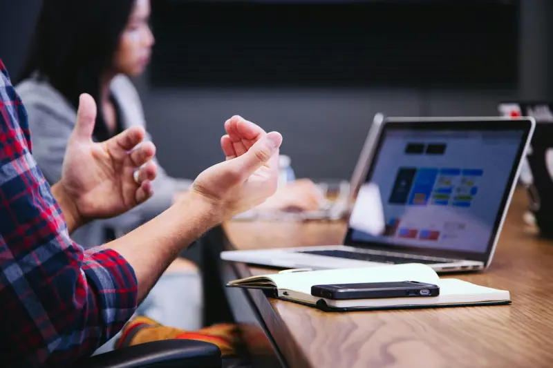 image of computer on meeting table